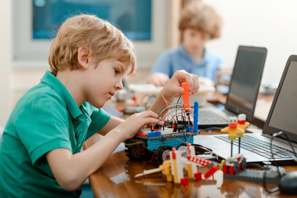 Boy,Tighten,A,Screw,With,A,Screwdriver.,Primary,Student,On