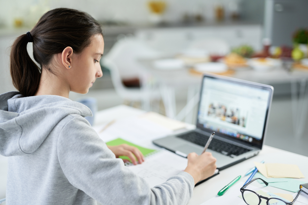 Knowledge,Is,Power.,Concentrated,Latin,Teenage,Girl,Writing,In,Her